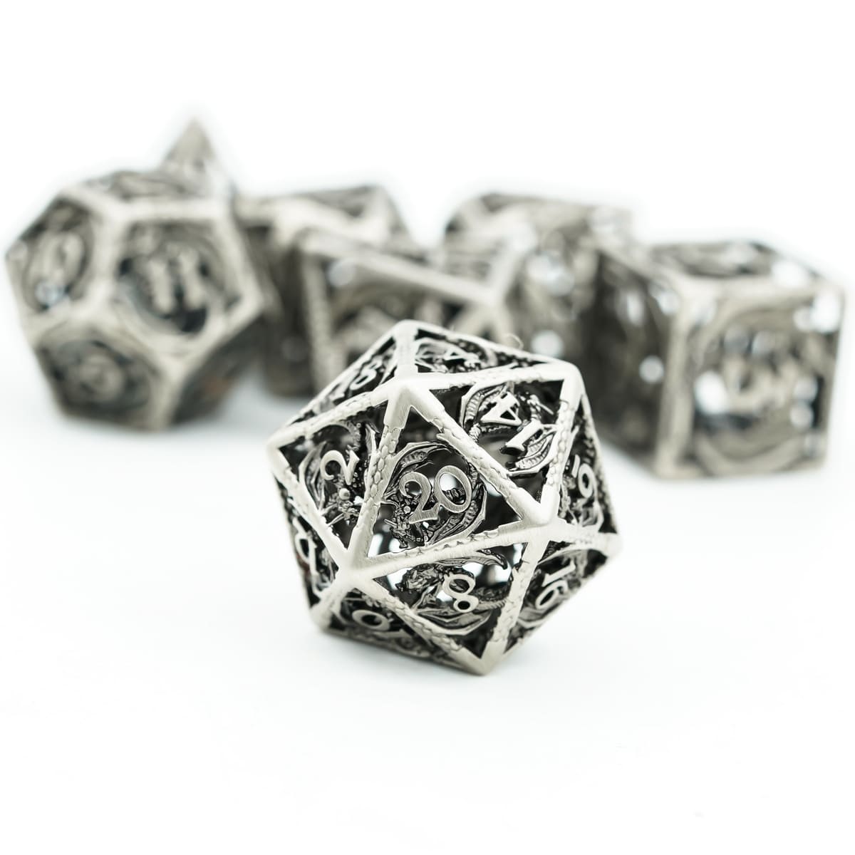 Close-up of hollow metal D20 from Ancient Silver Dragon dice set for fantasy DND and TTRPG games