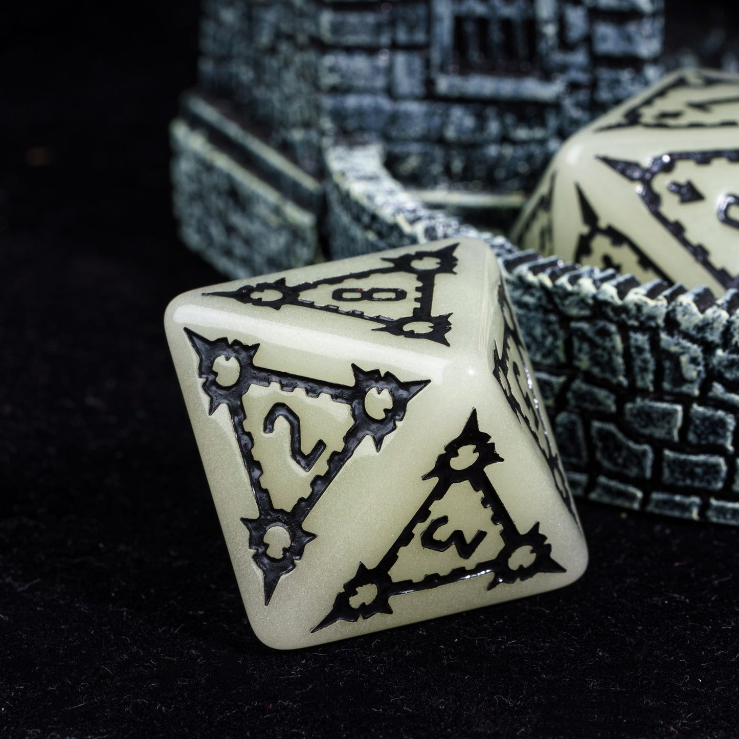 Castle Glow & Black Huge Dice Set closeup of D8 with black gothic numbers for DnD & DnD 5e