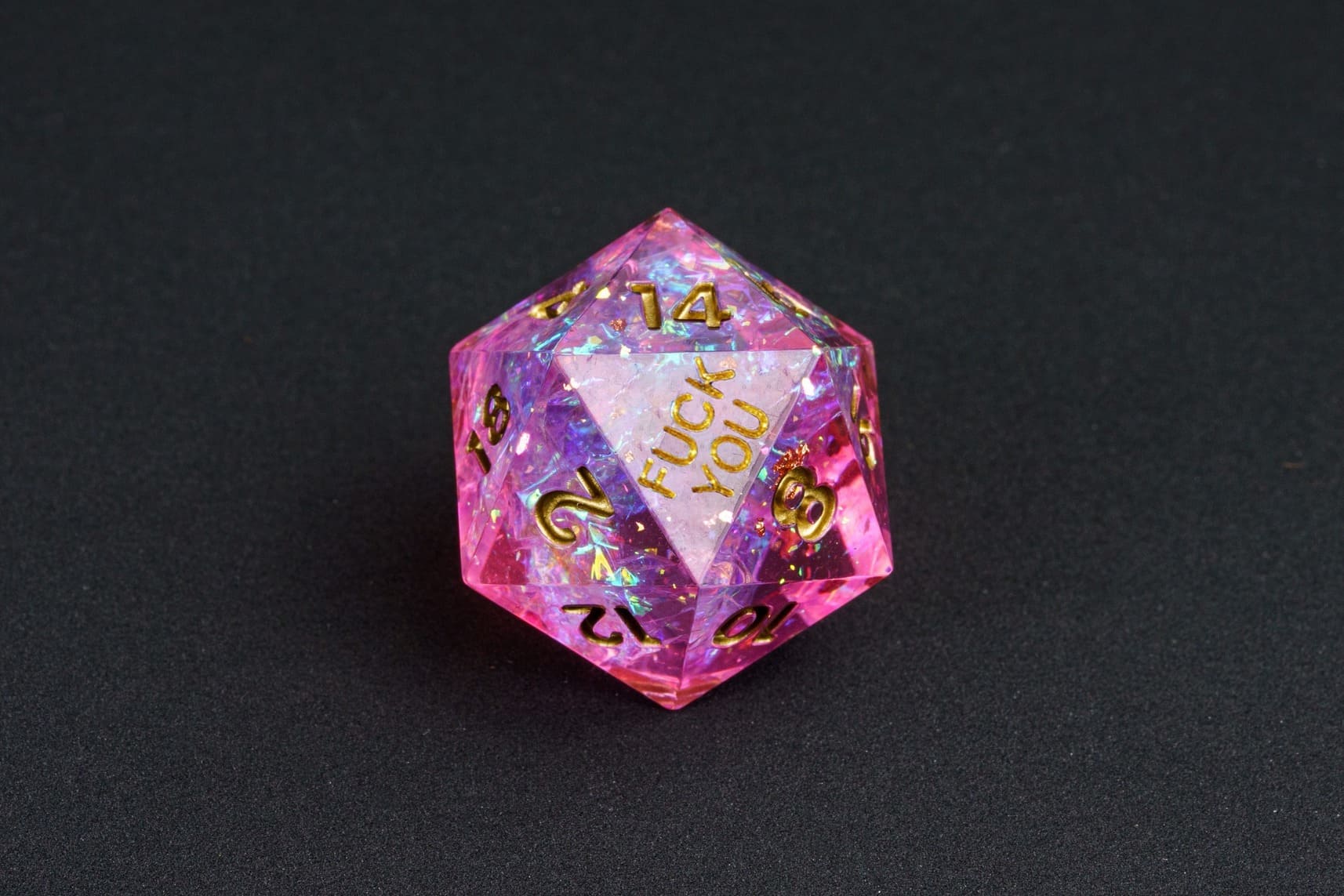 Celestial Heart sharp-edge D20 from the Fck Me Dice Set, pink resin with gold numbering and 'Fck You' lettering
