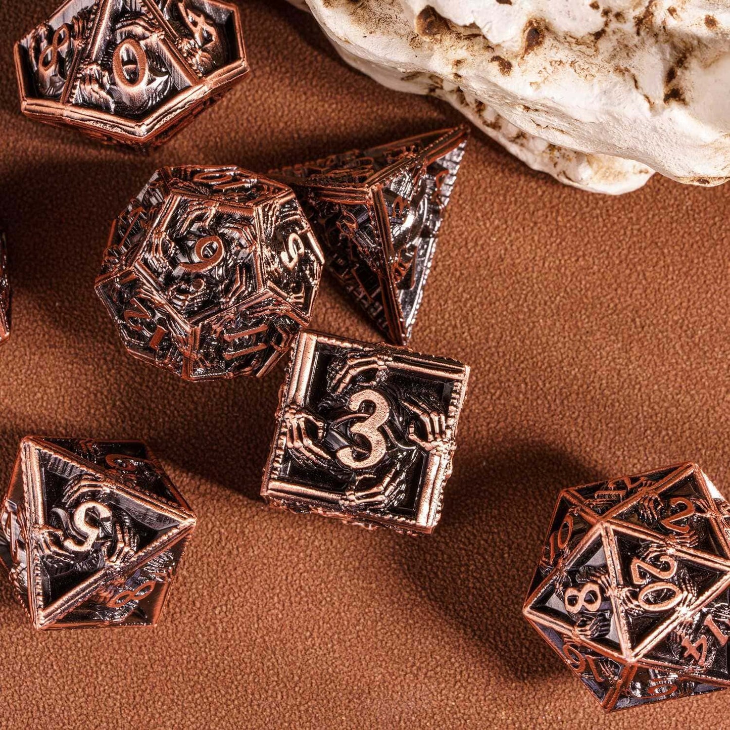 Copper Relic Metal Dice Set focus on twenty-sided die