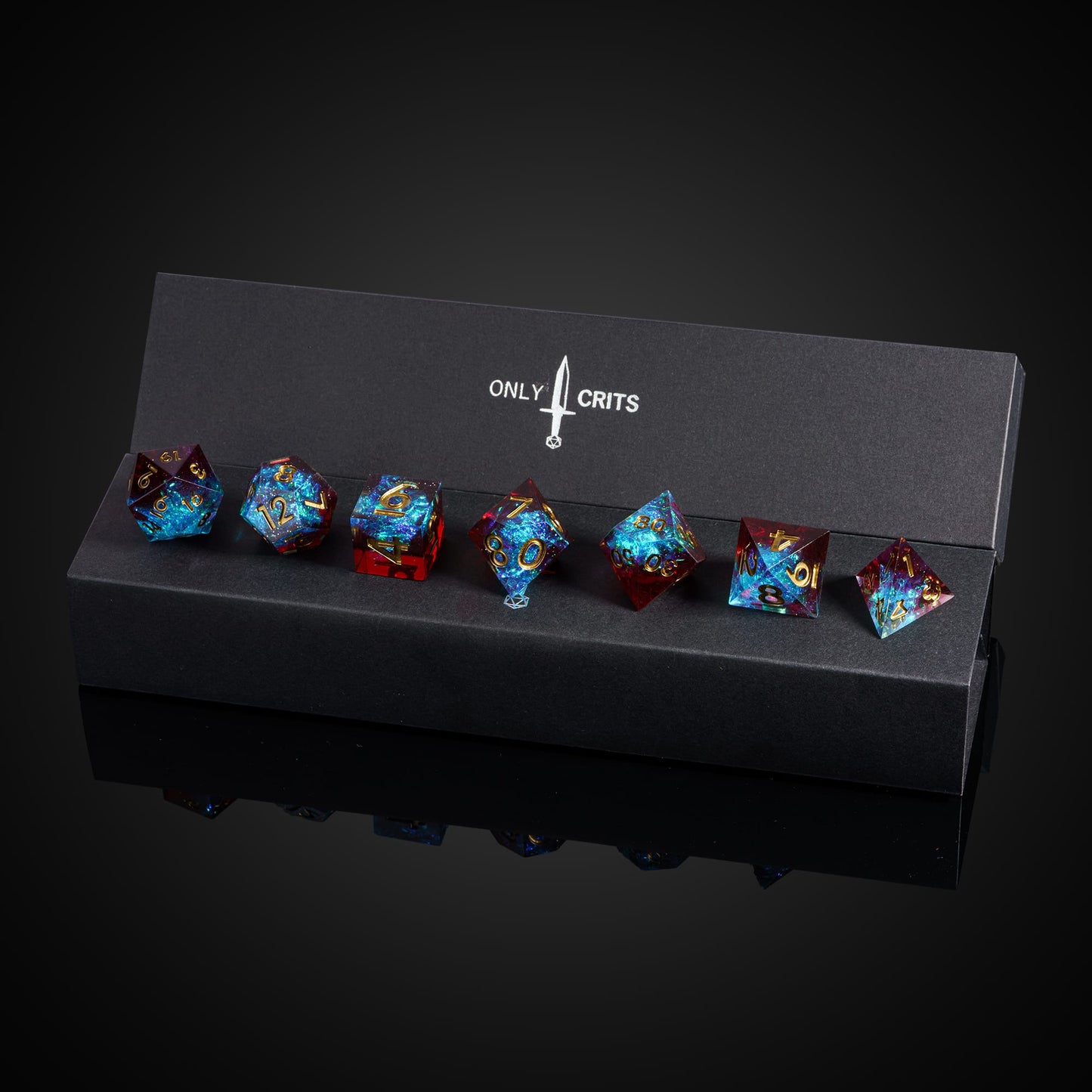 Corrupted Cobalt sharp edge dice set arranged in Only Crits black display box
