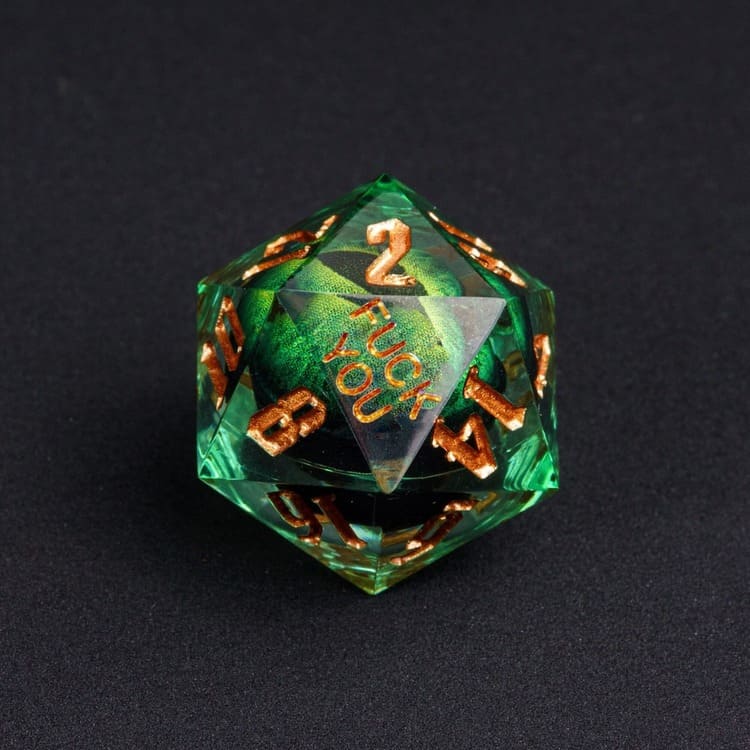 Close-up of the Dragon Eye Red D20 from the Fck Me Sharp Edge Dice Set, transparent red resin with fiery red swirl inside, gold numbering, and 'Fck You' lettering