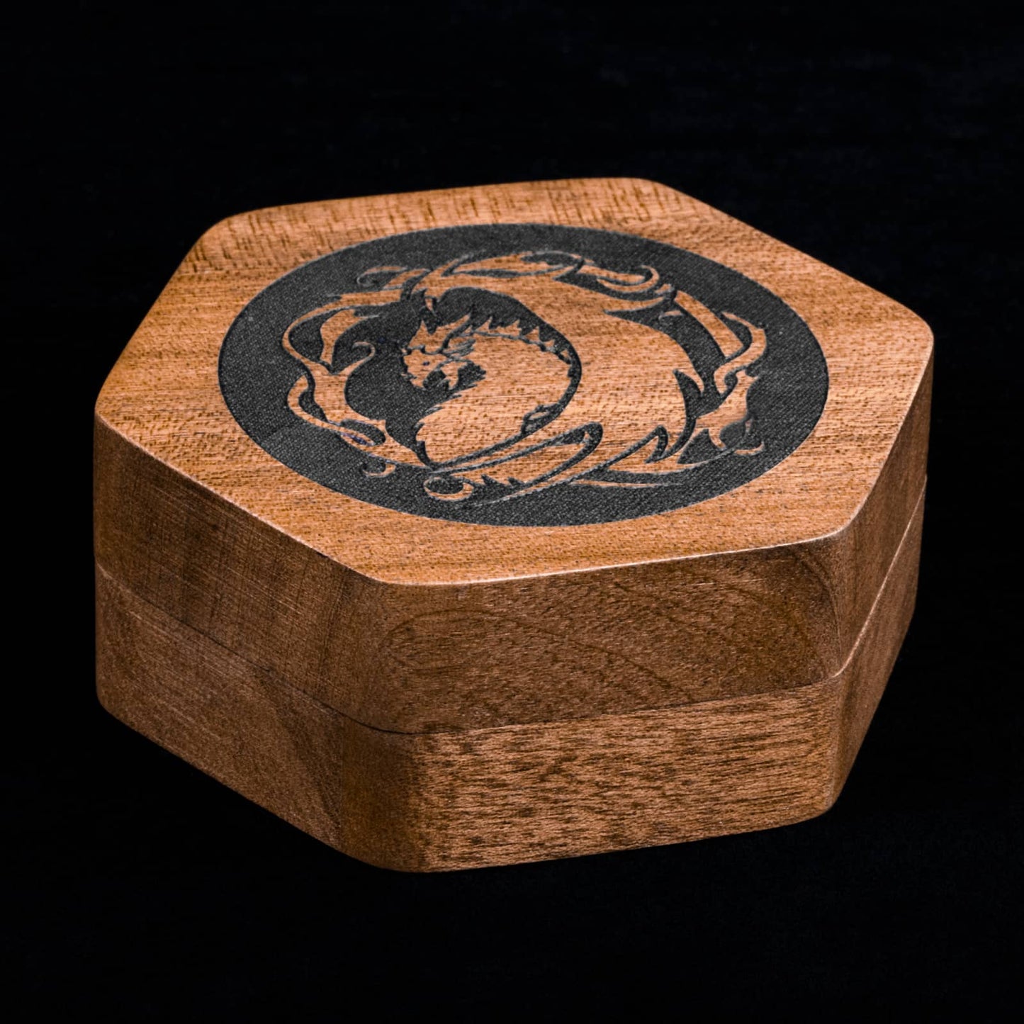 Top view of Embercoil Vault sapelli dice case featuring detailed dragon engraving