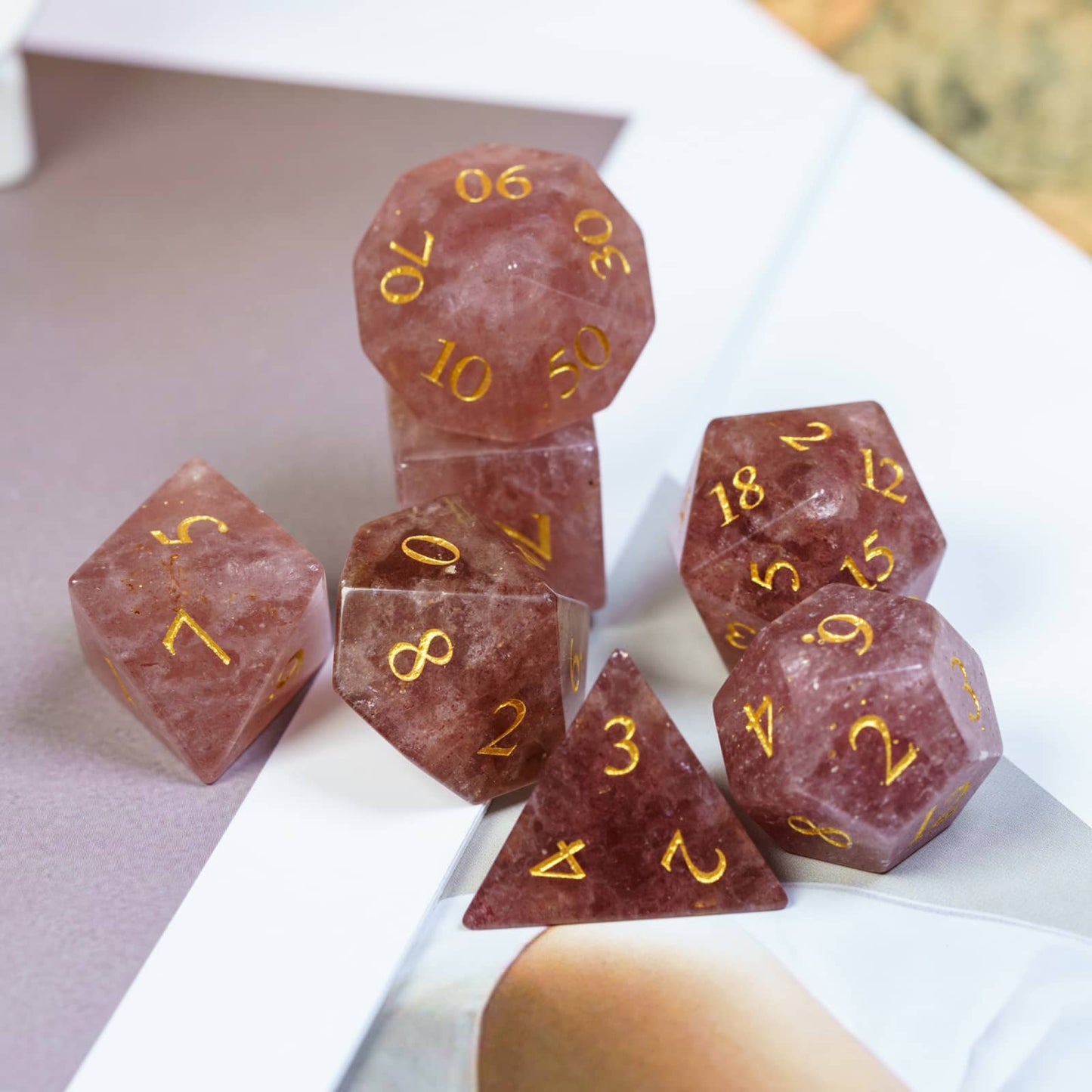 Complete 7 piece Ember Rose stone dice set from Fabled Crystals Stone Dice Series for DnD and TTRPG campaigns