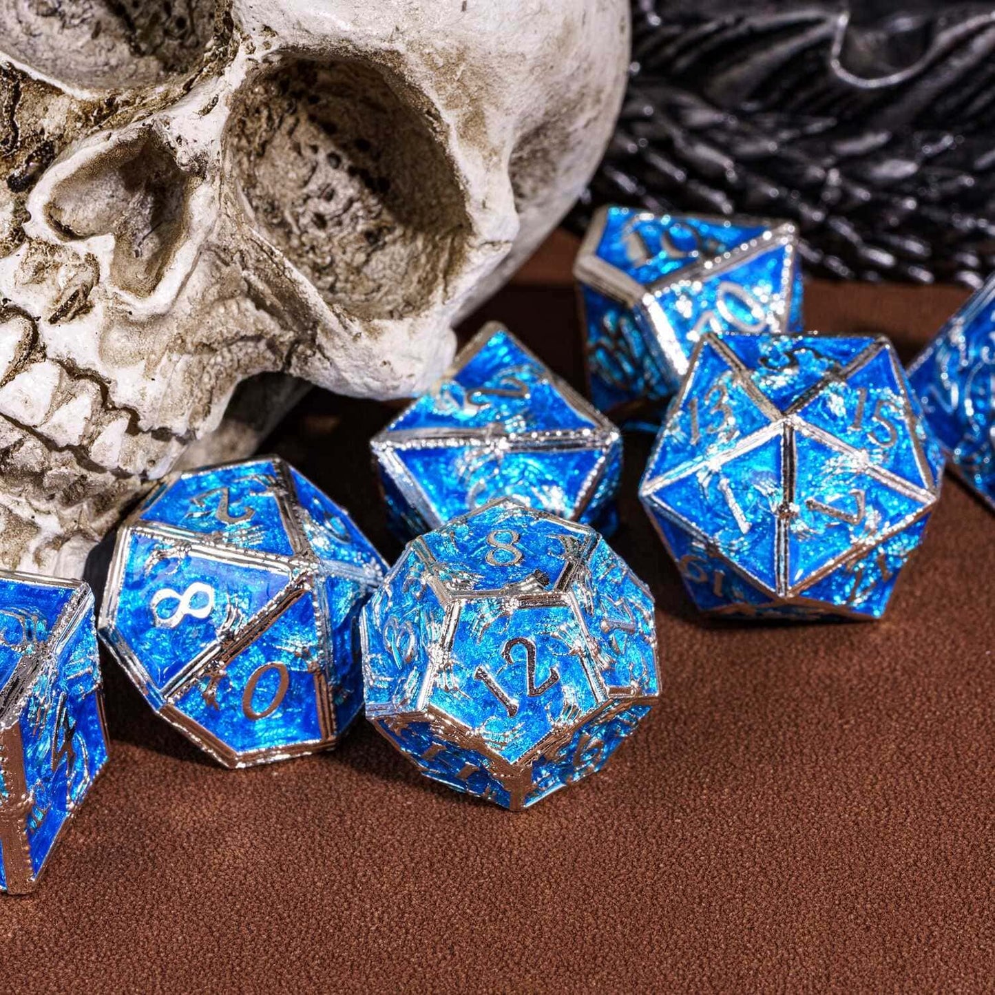 Frosted Crypt Metal Dice Set blue and silver dice stacked in tabletop display