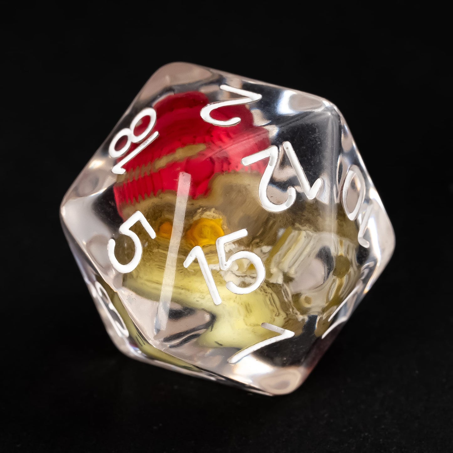 Close up of gator D20 inside clear resin dice with white numbers
