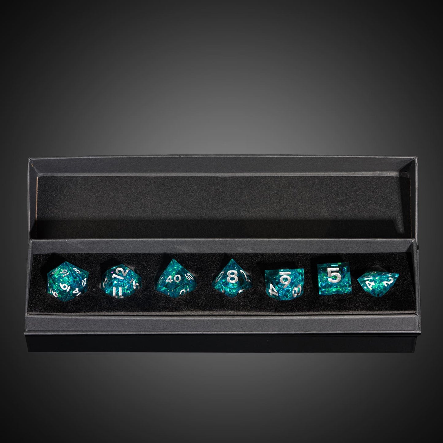 Icy Shard dice set in black box for DnD and tabletop RPG, teal resin dice with silver numbers