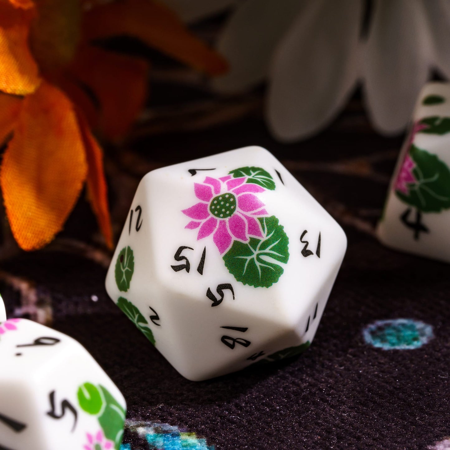 Close up of Lotus Blossom Dice Set d20 with pink lotus flower design for DnD & DnD 5e