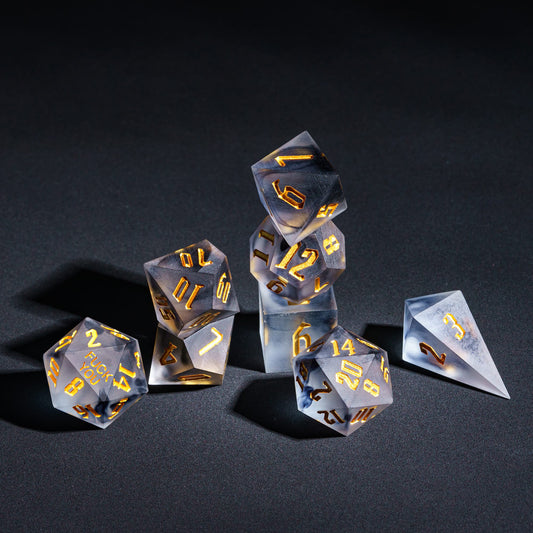 Nimbus Noir sharp edge dice set with smoky dark foil and gold numbering for DnD