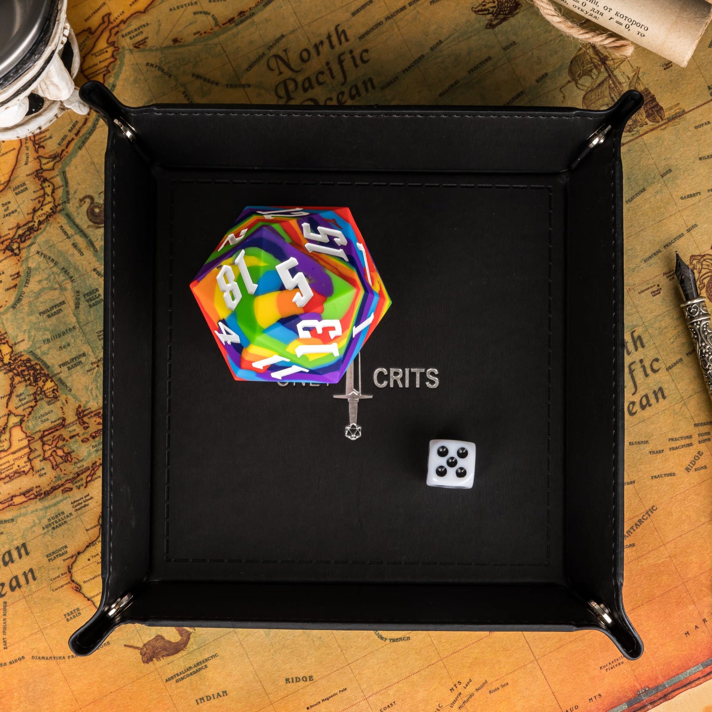 Black Only Crits Dice Tray with rainbow d20 and white d6 on map background, tabletop RPG accessory