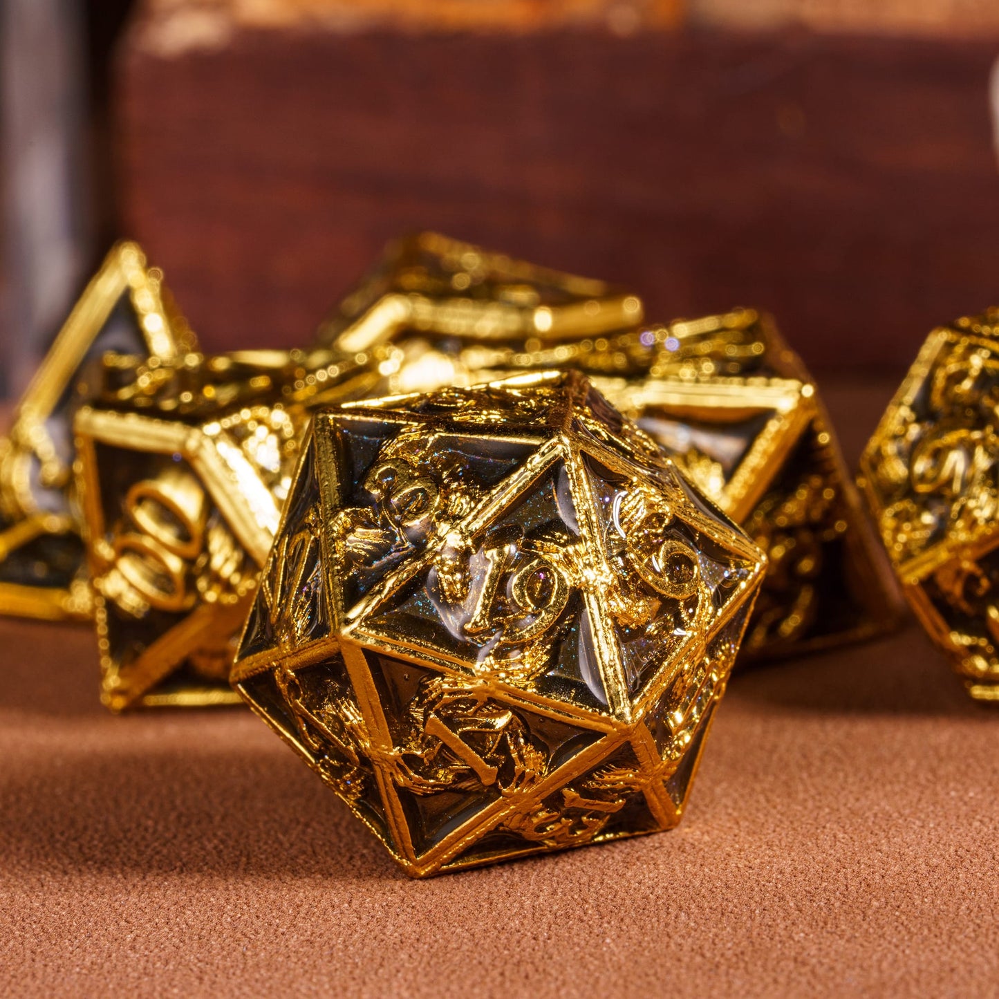 Onyx Crypt Metal Dice Set closeup of black & gold D20 die for tabletop roleplaying games