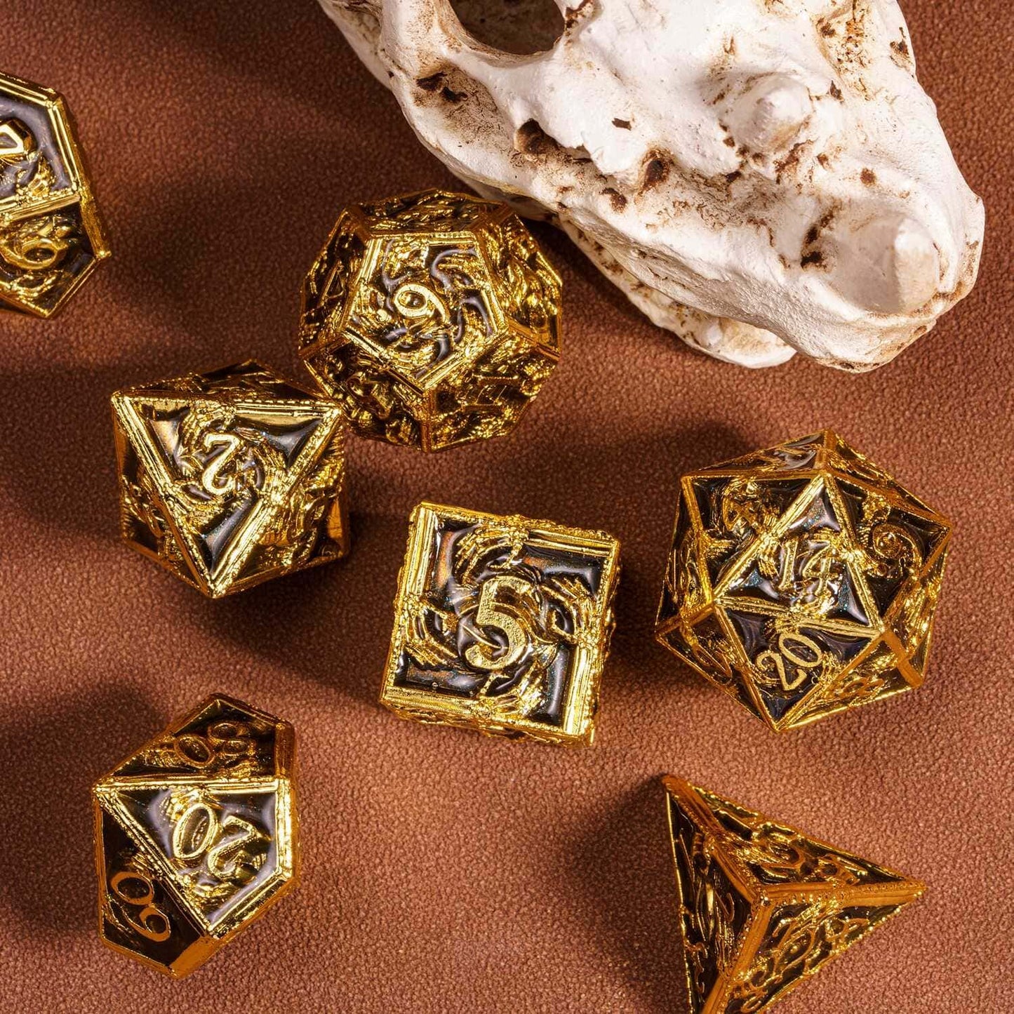 Onyx Crypt Metal Dice Set black & gold RPG dice flatlay with polyhedral dice assortment