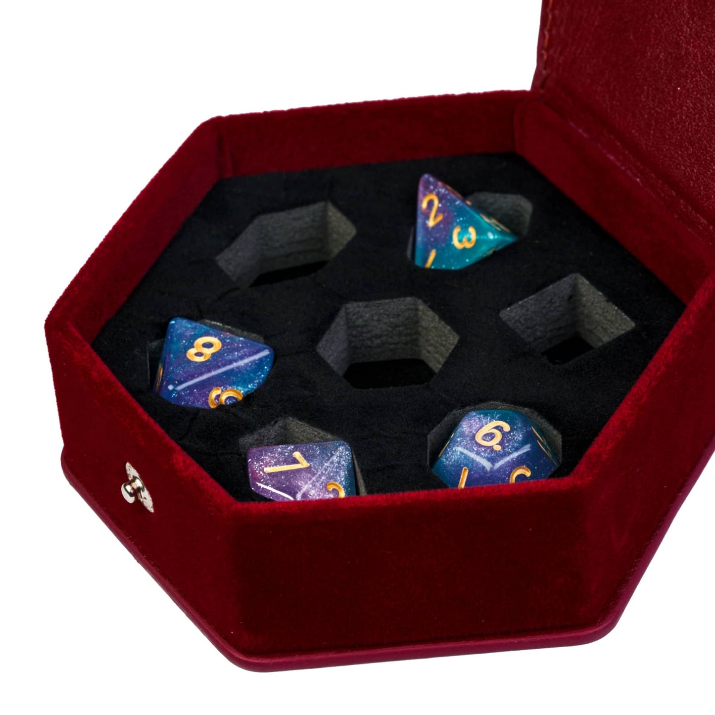 Red leather hexagon dice case open with galaxy-style dice set inside