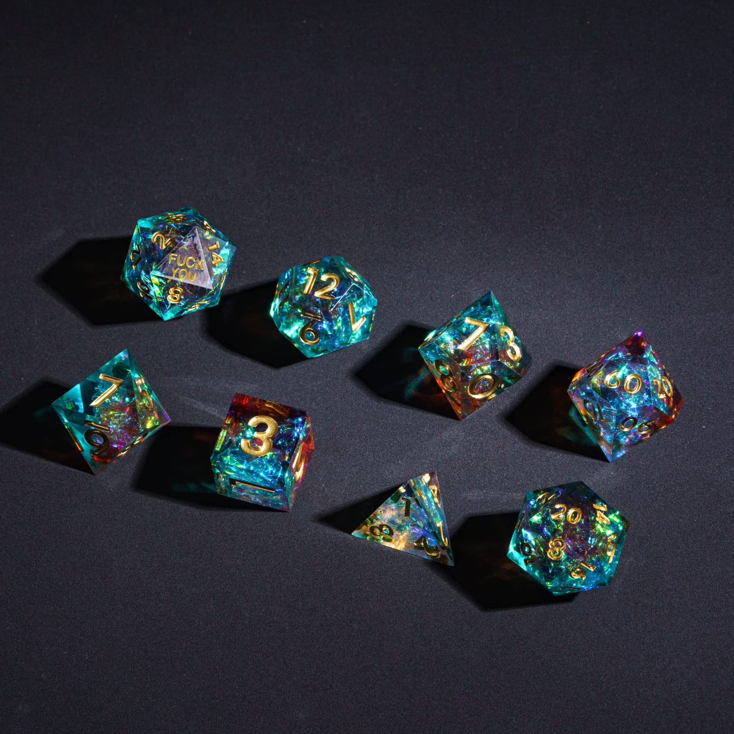 Flatlay of Starlight Nebula F*ck Me Sharp Edge Dice Set 7-piece dice collection for DnD & DnD 5e