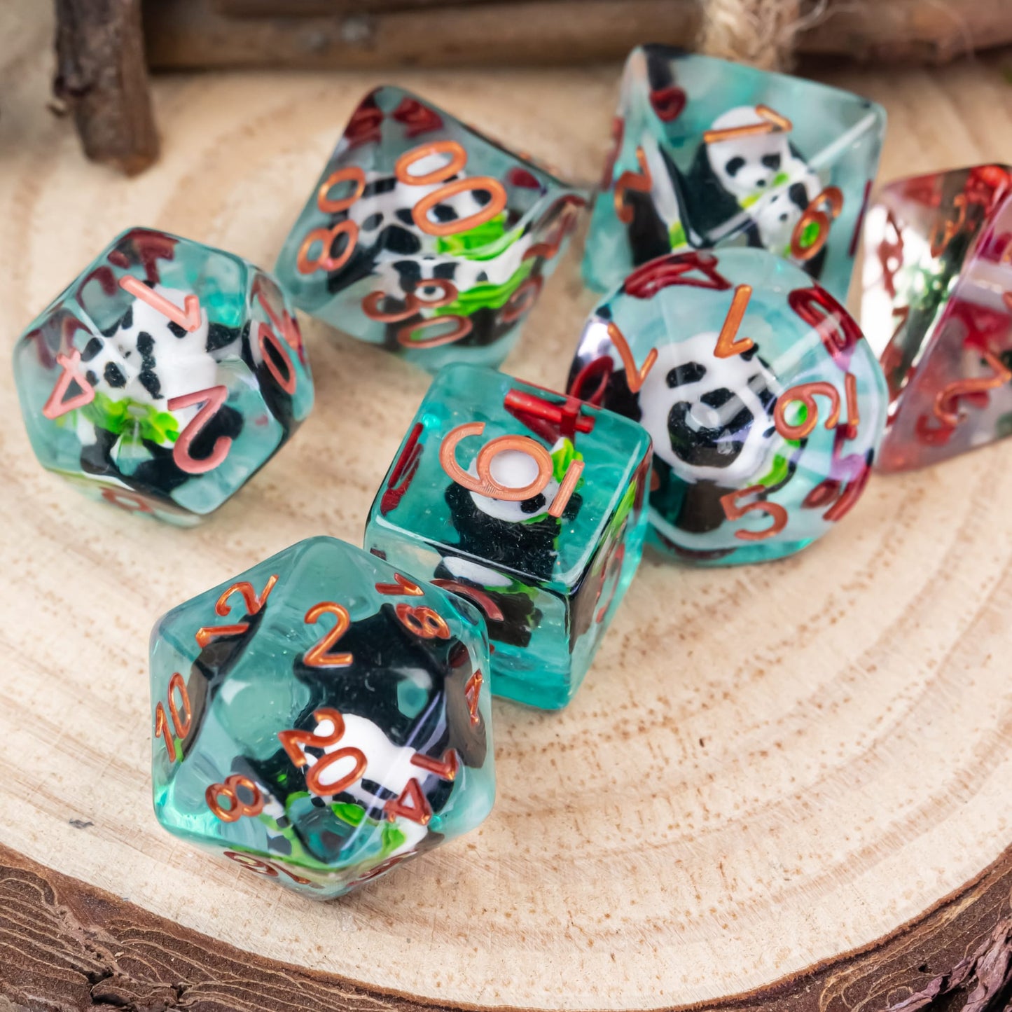 Transparent Bamboo Panda Dice Set arranged on wood slice showing panda figures and copper numbers
