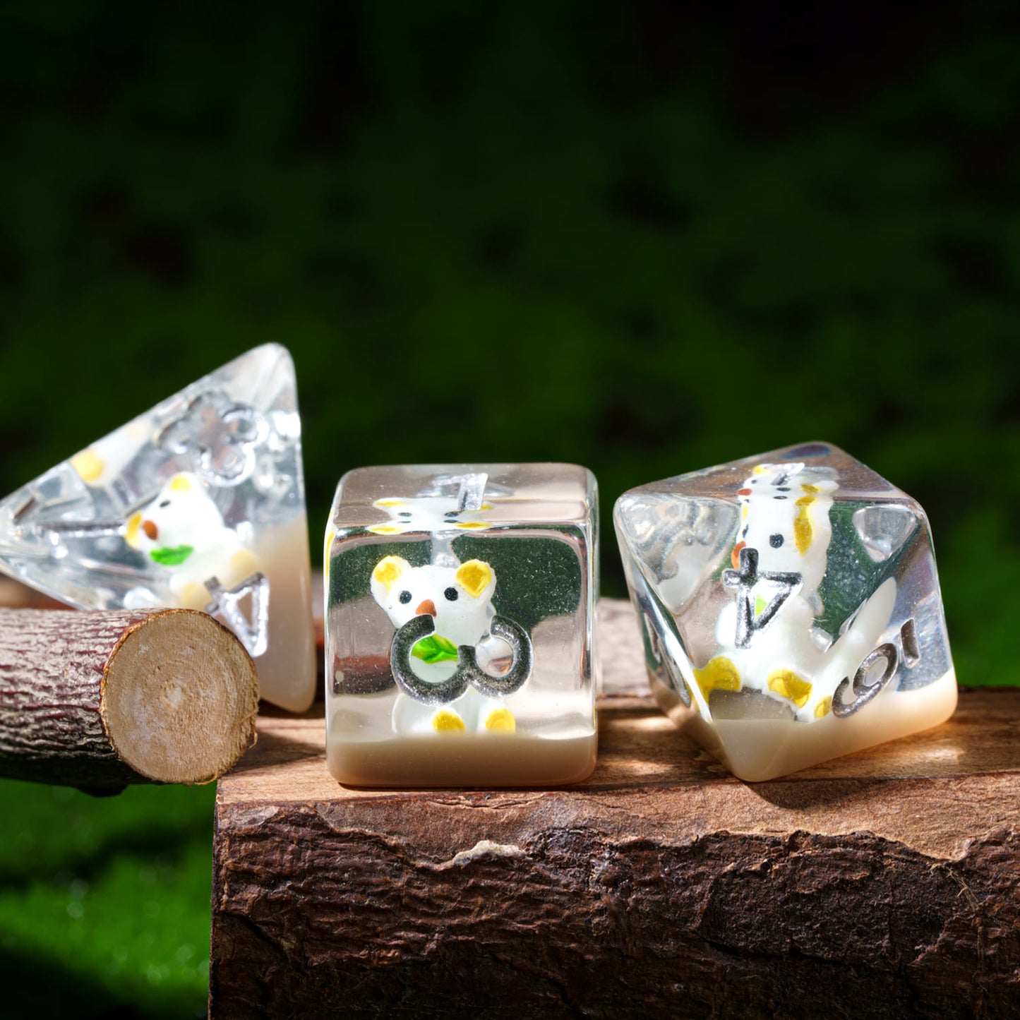 Transparent Koala dice set displayed on wood, resin polyhedral dice with koala inside for RPG