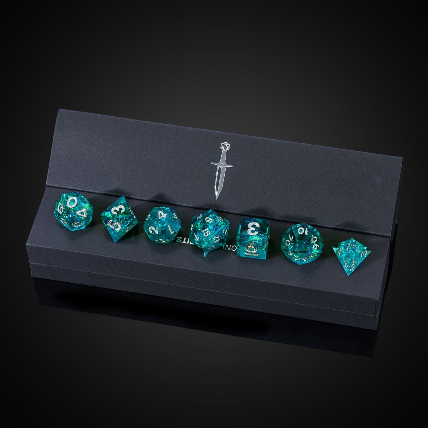 Turquoise Soul sharp edge dice set in black Only Crits display box with logo and turquoise foil