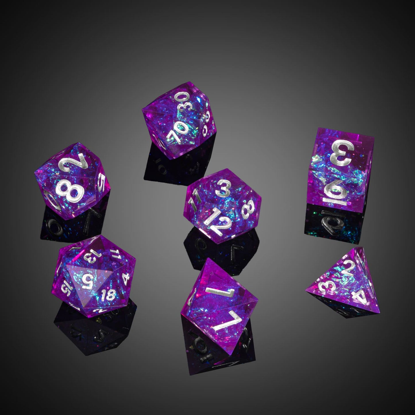 Loose Violet Beam dice on glossy black background, sharp edges with iridescent foil and silver numbering