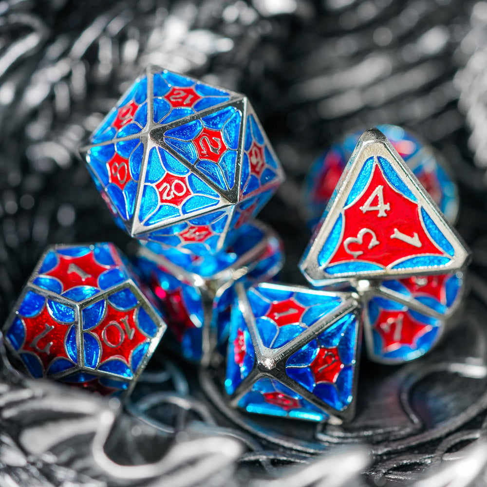 beautiful blue and red metal dice set, d20 and d4 on top