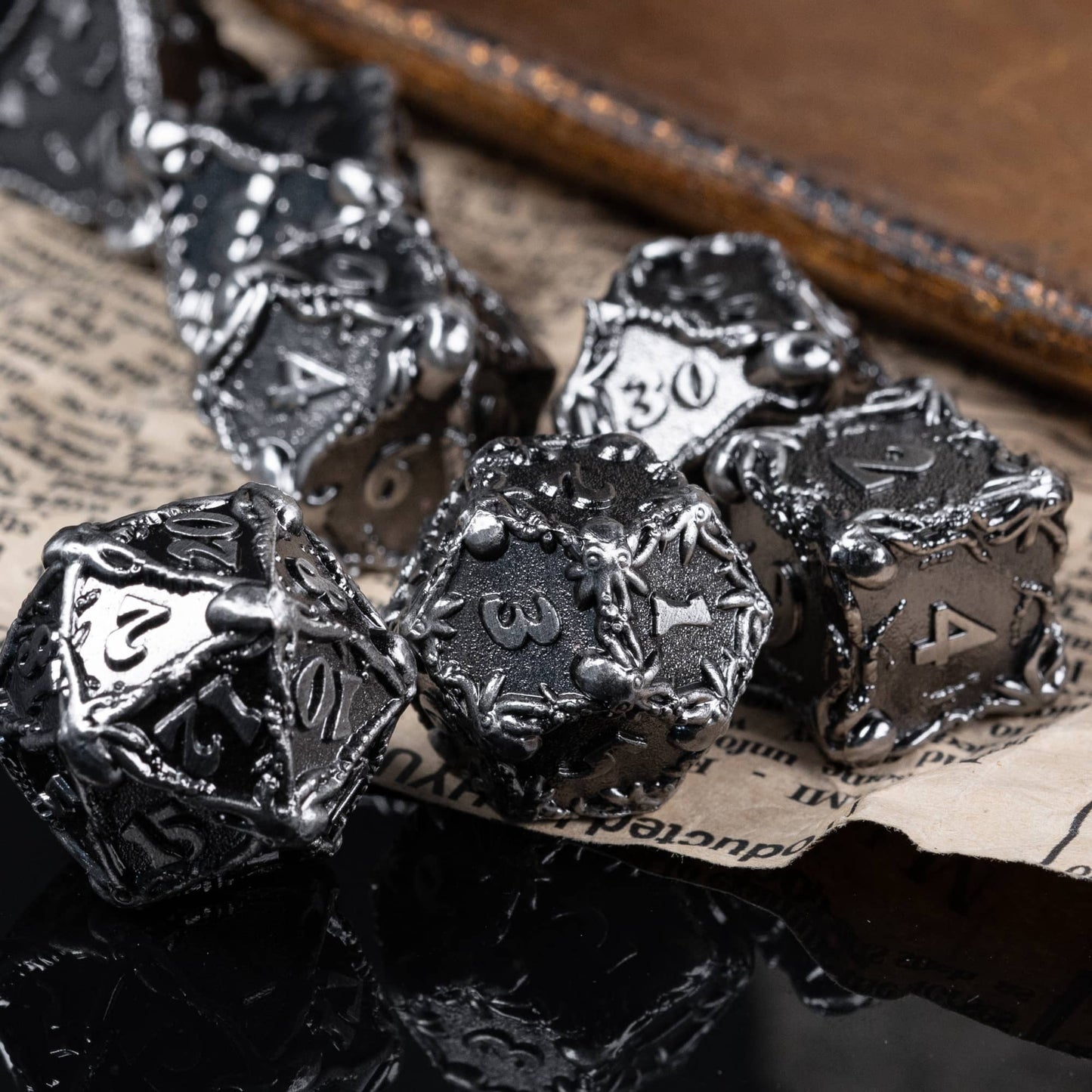 Dark grey metal octopus dice