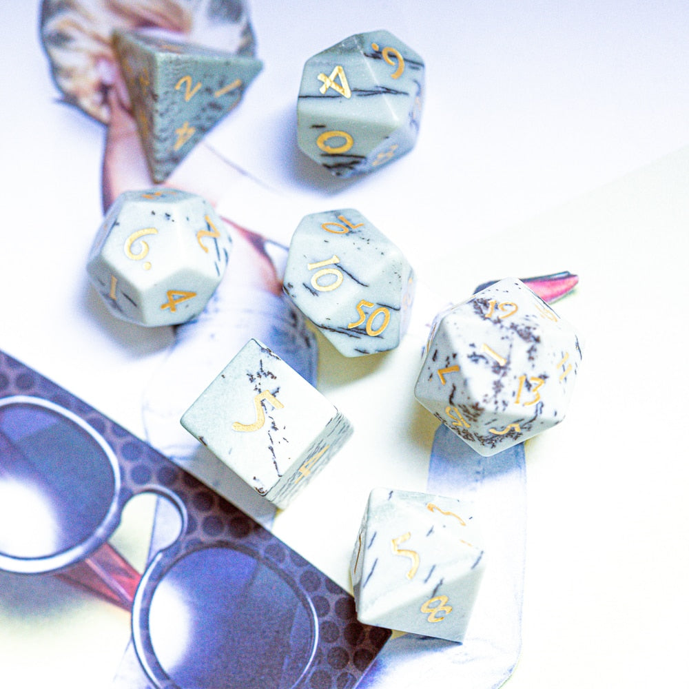 Birch Stonework stone dice set displayed on magazine background with birch tree color pattern
