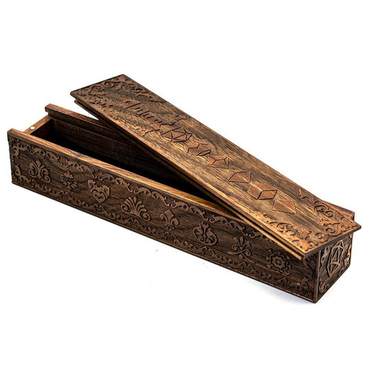 Wooden engraved dice case displayed on tabletop with sliding lid
