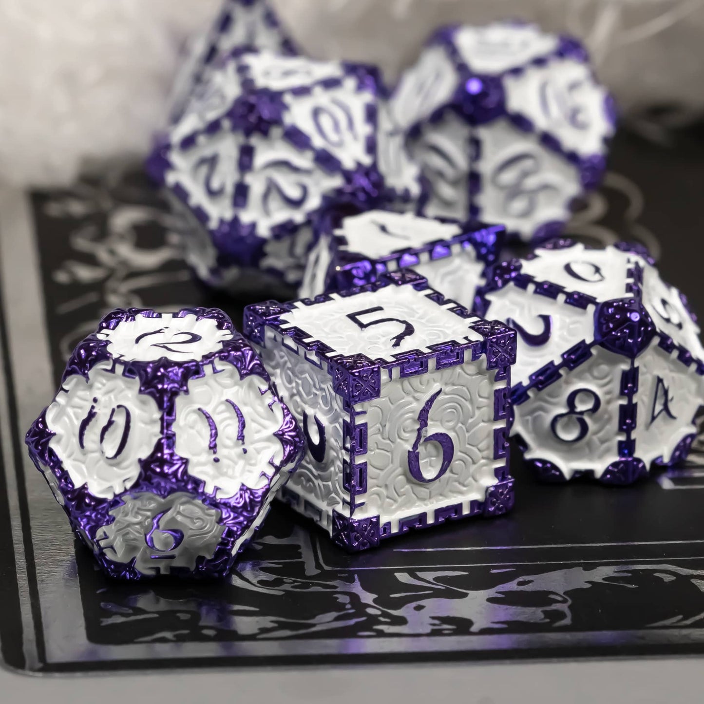 Lavender Blade metal dagger dice set for DnD & TTRPG, close-up on black surface