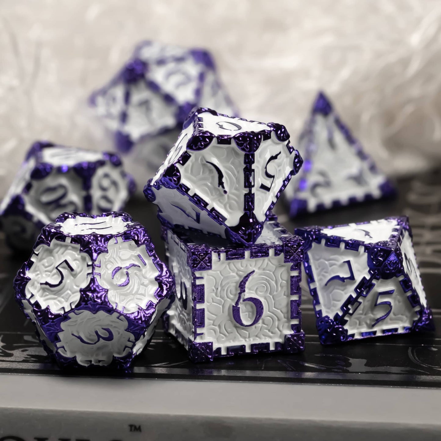 Lavender Blade metal dagger dice set for DnD & TTRPG, display on black surface