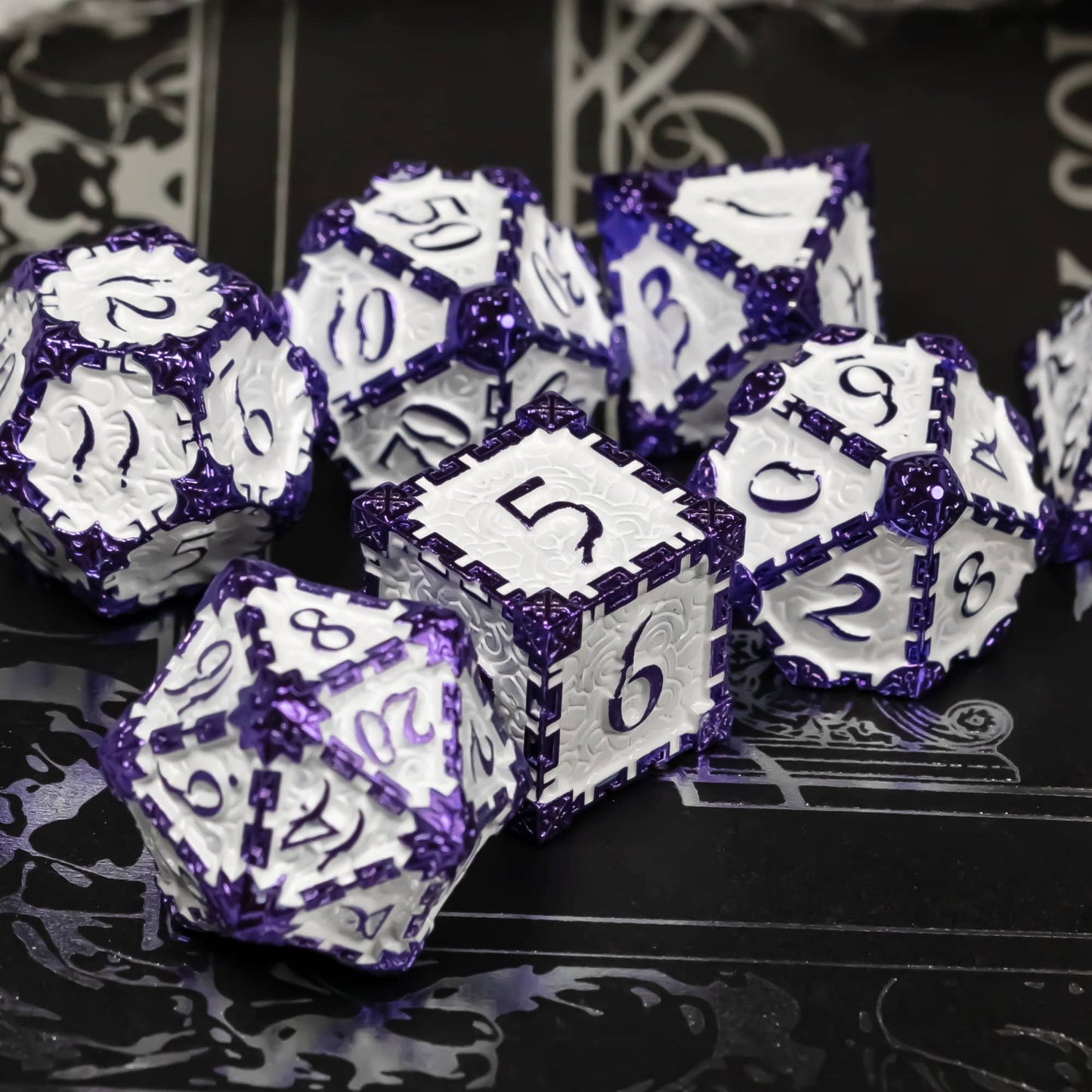 Lavender Blade metal dagger dice set for DnD & TTRPG, group display on black surface