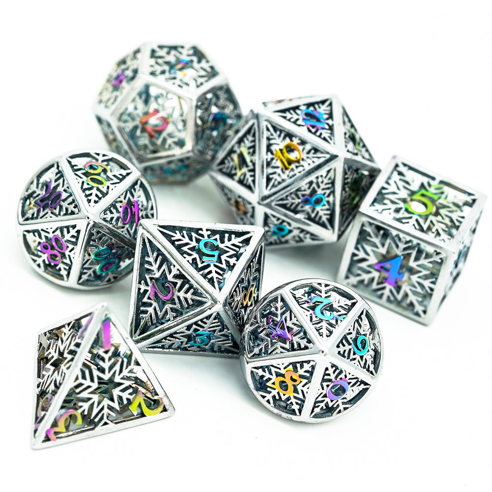 Hollow silver dice with rainbow numbers laid out on white for DND RPG and D&D 5e play