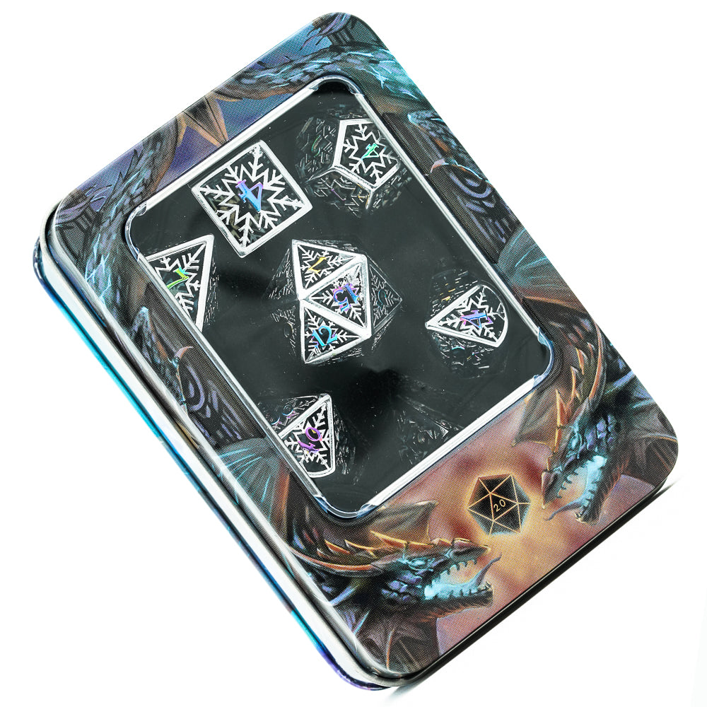 Prismatic silver snowflake DND dice set shown inside fantasy dragon-themed tin dice case