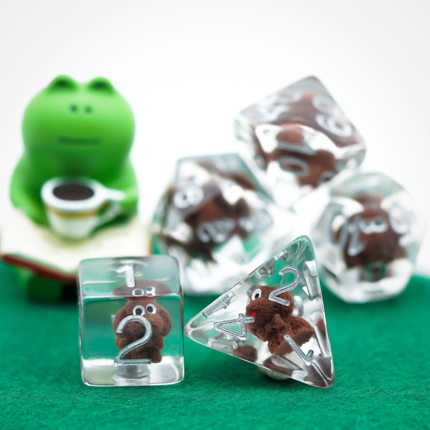 Transparent Doggo d4 and d6 dice for DnD & TTRPG, close-up with frog figurine in background