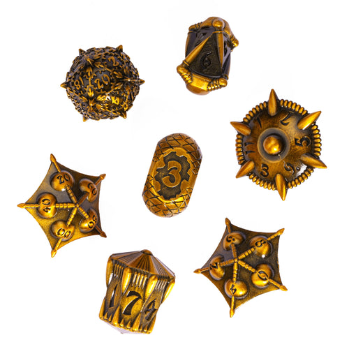Flat lay of Eldritch Edge Metal Dice Collection Ancient Gold variant, 7 piece RPG dice set for DnD & tabletop