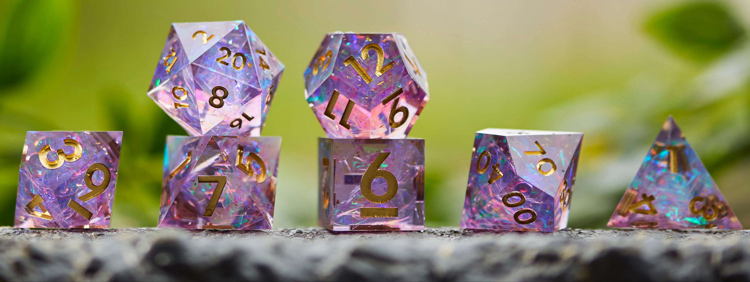 Celestial Heart - Sharp Edge Dice Set -purple translucent dice with iridescent flakes and gold numbers, styled for fantasy RPGs.