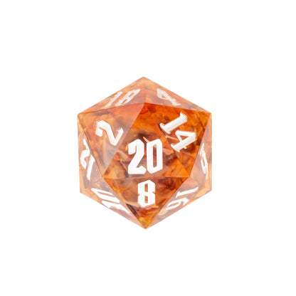 Aether Shards Sharp Edge Dice Set D20 close-up showcasing translucent amber resin with gold foil inclusions and white numbering