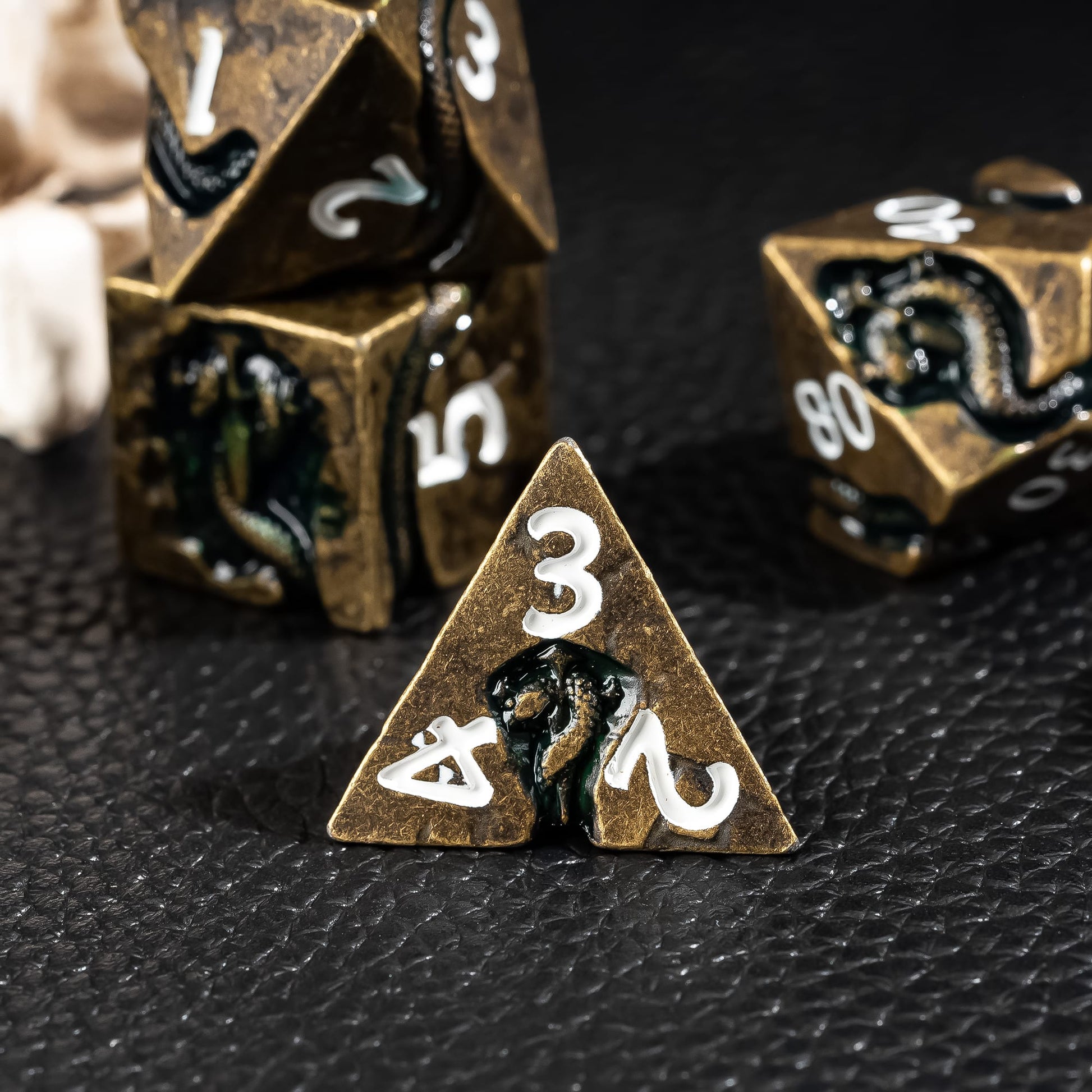 Ancient Bronze Serpent metal D4 close up on dark background for DnD dice photography