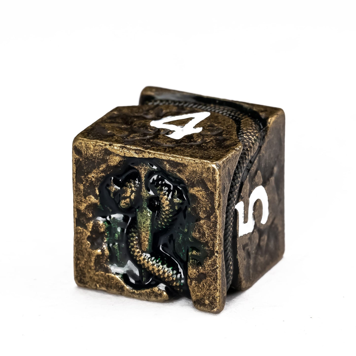Close up of Ancient Bronze Serpent metal D6 with engraved serpent and antique bronze finish