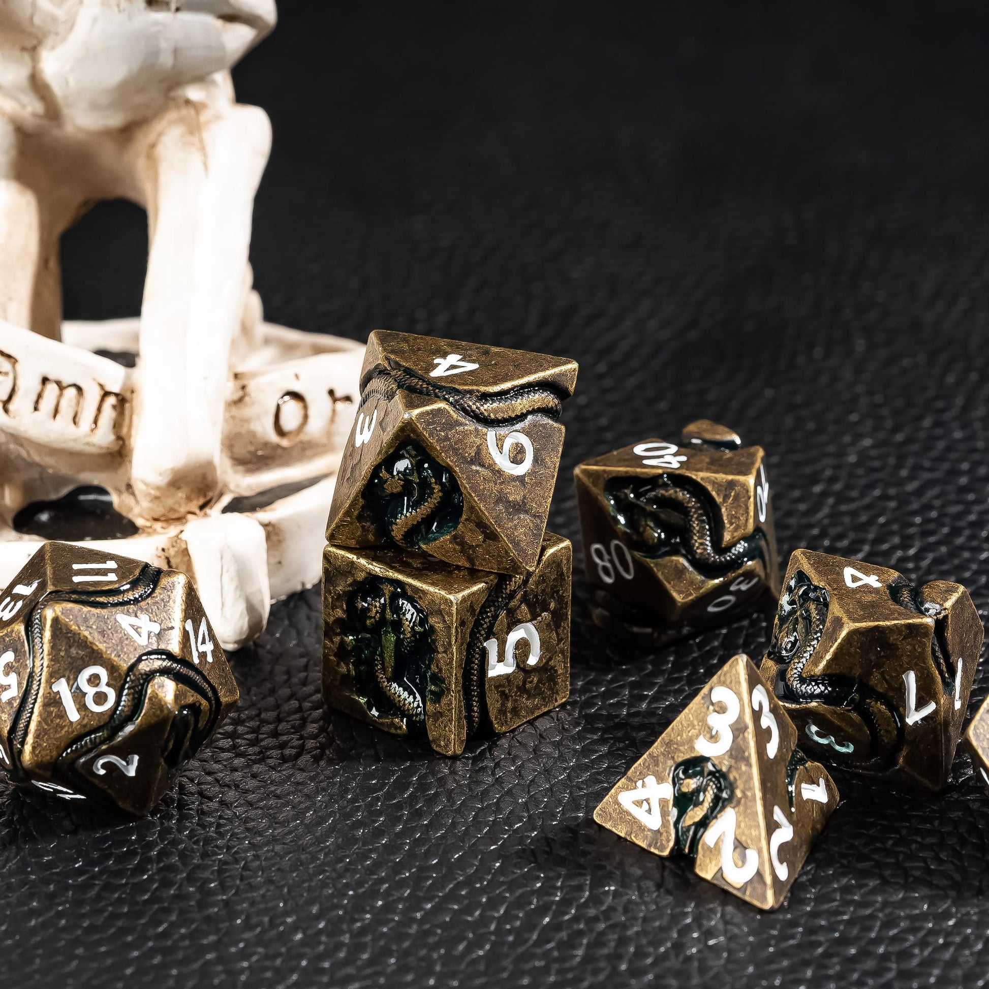 Ancient Bronze Serpent metal dice set styled in dark fantasy tabletop RPG scene