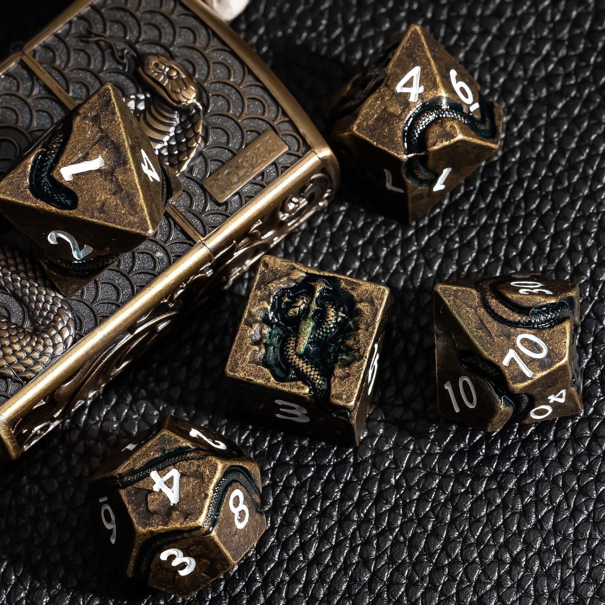 Ancient Bronze Serpent metal dice shown with decorative metal dice case for DnD
