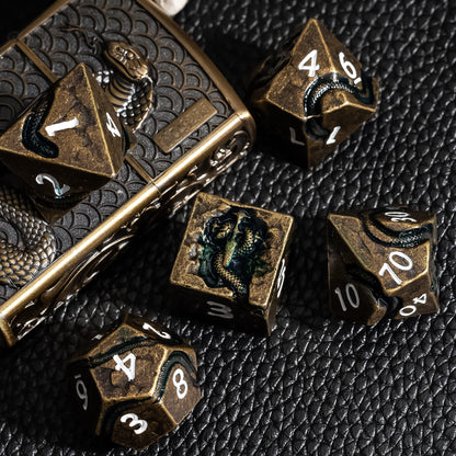 Ancient Bronze Serpent metal dice shown with decorative metal dice case for DnD