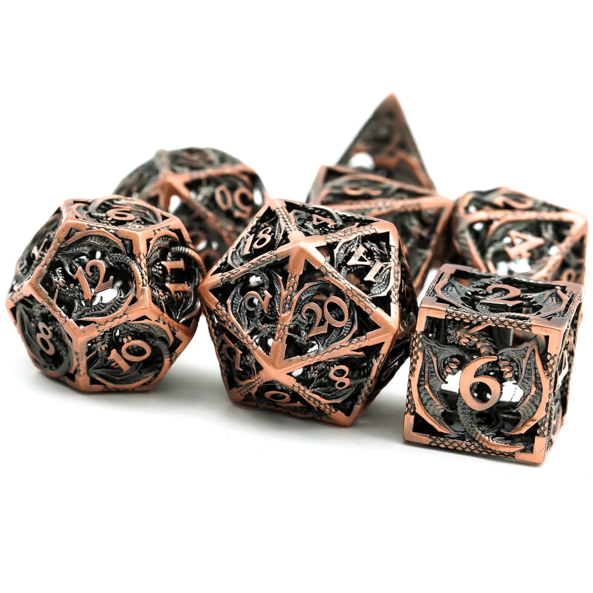 Copper hollow metal dice set with dragon details shown in studio lighting for DND and RPGs