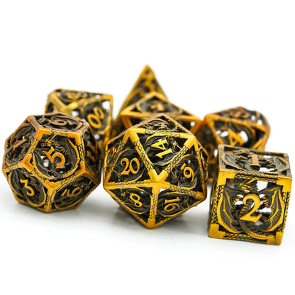 Three D6 hollow dice in copper, brass, and gold variants with dragon detailing