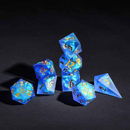 Azure Abyss sharp edge dice set with glowing blue foil and gold numbering for tabletop gaming