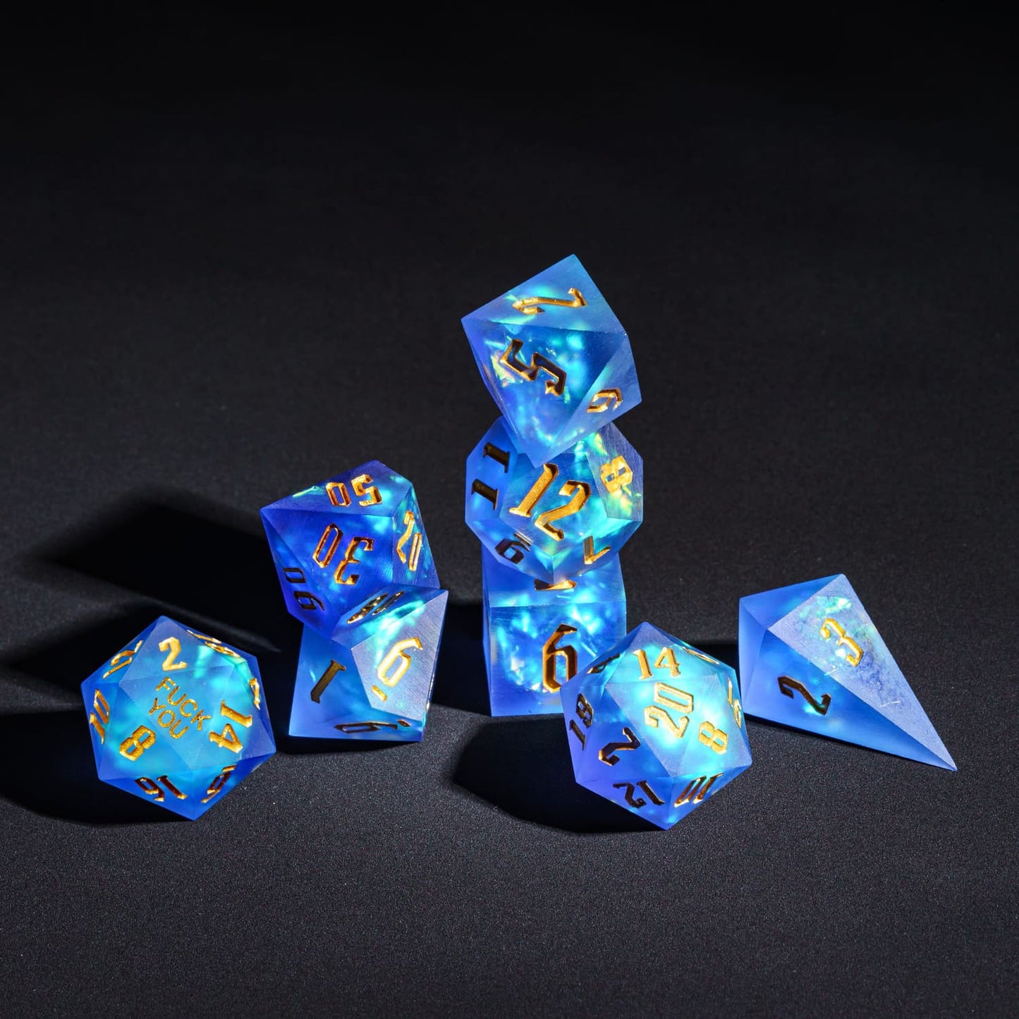 Stacked display of Azure Abyss F*ck Me Sharp Edge Dice Set showing all 7 pieces for DnD & DnD 5e