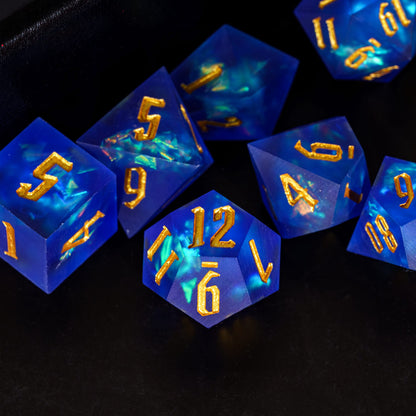 Closeup of Azure Abyss Sharp Edge Dice Set blue resin with gold numbering for DnD & DnD 5e
