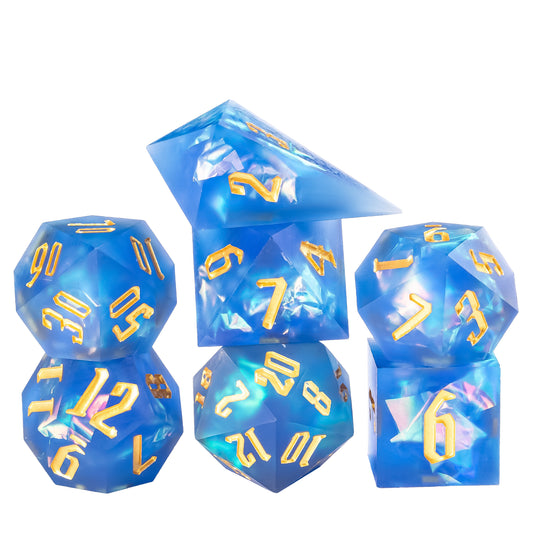 Stacked display of Azure Abyss Sharp Edge Dice Set 7 piece resin dice collection with deep blue tones and gold numbers for DnD and DnD 5e