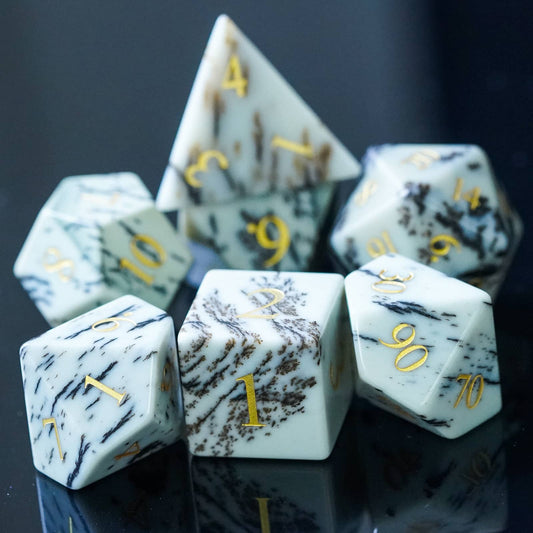 Birch Stonework Stone Dice Set grouped together on glossy black surface for DnD players