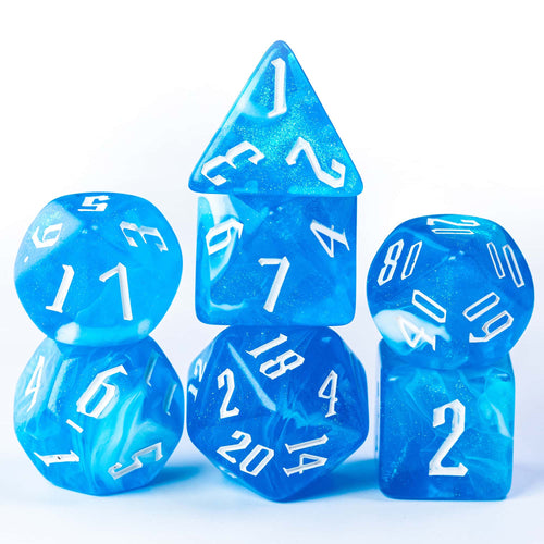 Blue Ice Dice Set 7 piece polyhedral resin dice with white ink on clean background for DnD