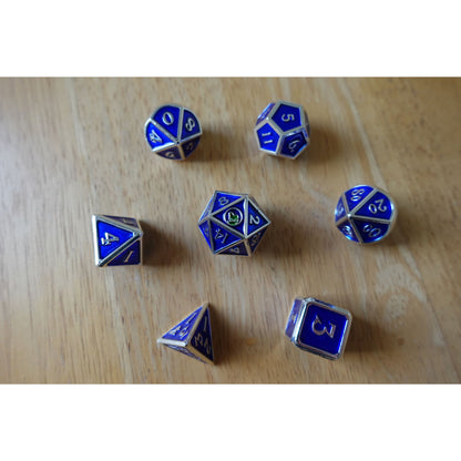 Full 7-piece Bob World Builder dice set in blue & silver laid out on wooden table