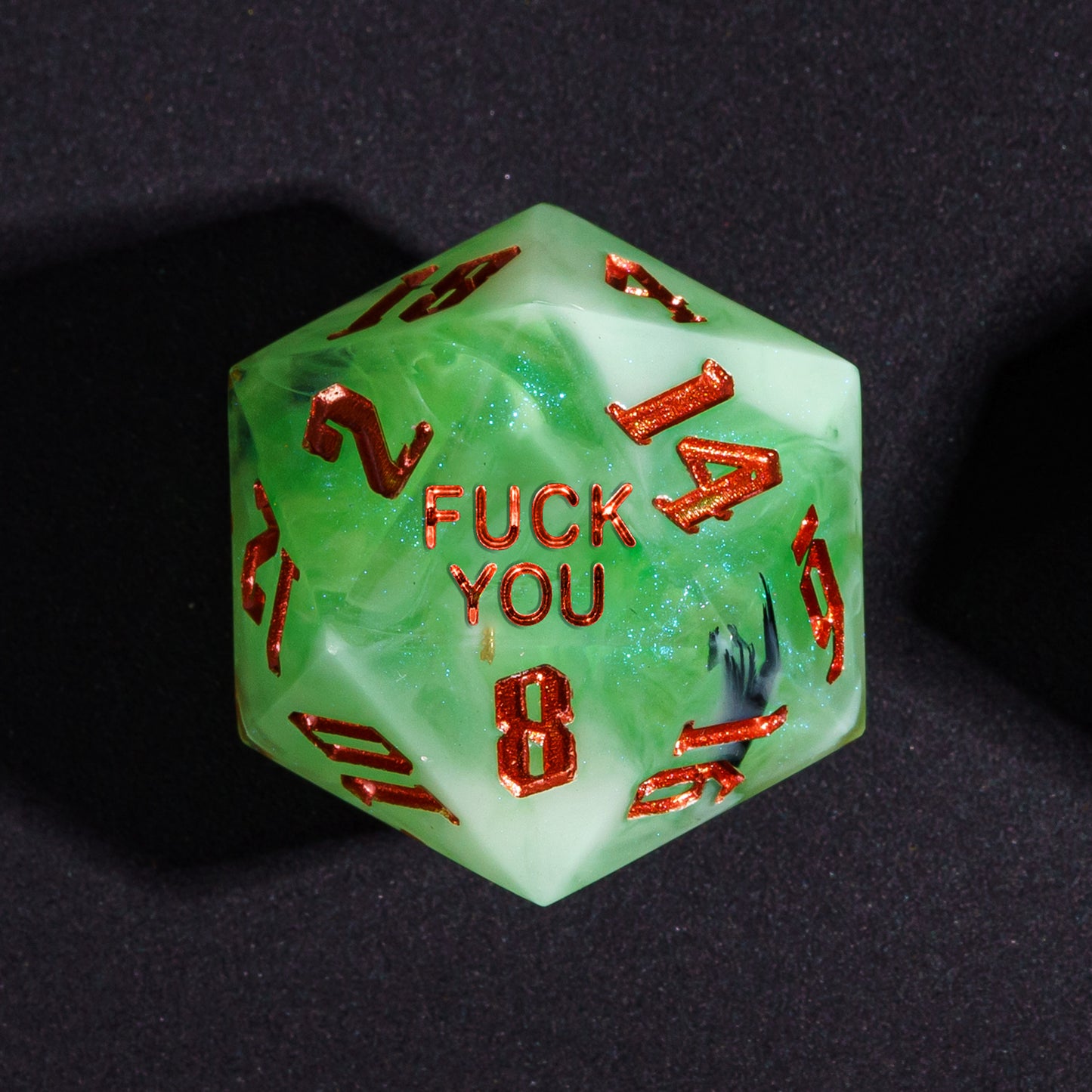Close up Bog Hag Fuck You D20 with swamp green resin and red numbers
